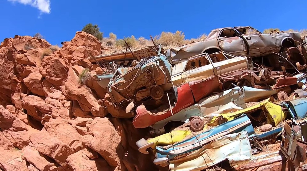 why there’s a wall of junk cars in a Utah canyon